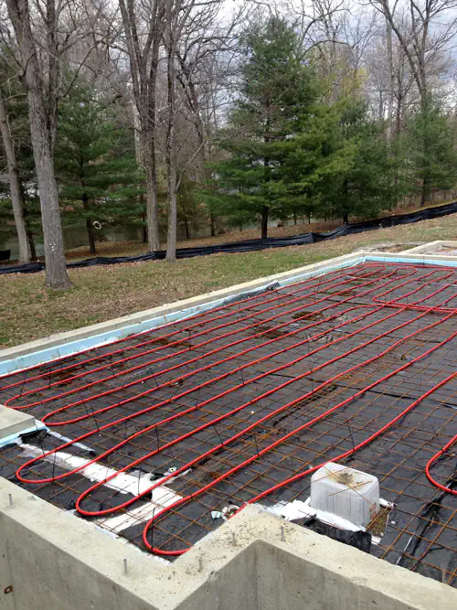 Radiant floor heating pipes installed in a new home foundation.